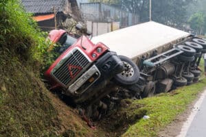 Truck accident on mountainous road in Jackson, Mississippi with an injured victim in need of a Jackson truck accident lawyer.