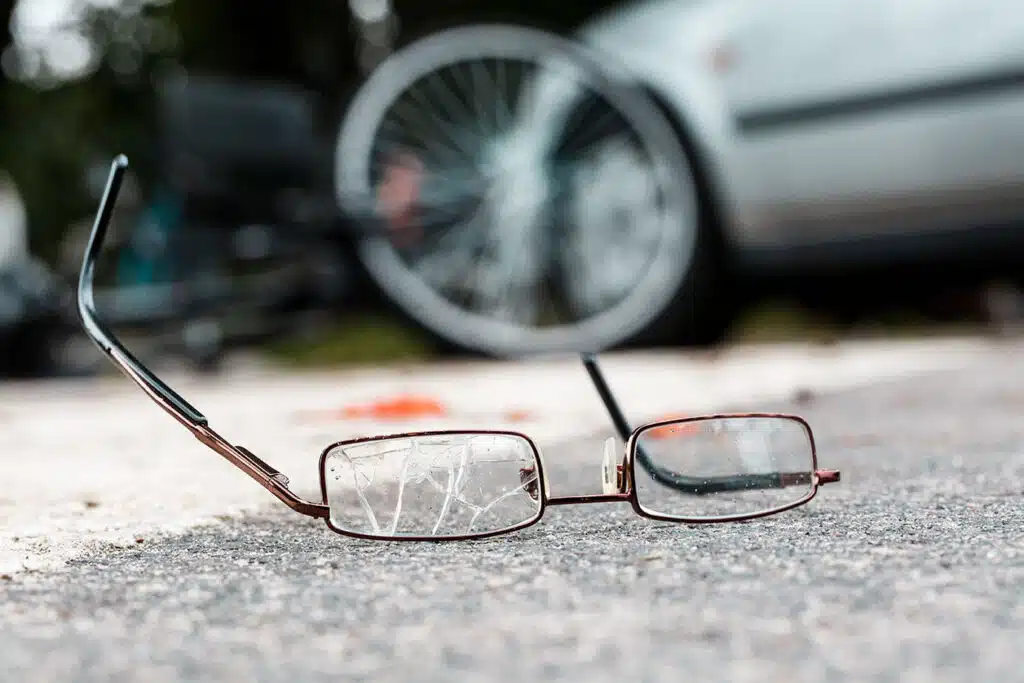 Broken glasses of fatal truck accident victim on the street